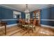 Formal dining room with hardwood floors, chandelier, and stylish decor at 5215 Silver Creek Dr, Lilburn, GA 30047