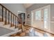 Inviting foyer with wood floors, staircase, and natural light at 5215 Silver Creek Dr, Lilburn, GA 30047