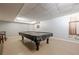 Basement game room featuring a covered billiard table, pool cues, and neutral paint at 5215 Silver Creek Dr, Lilburn, GA 30047