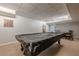 Basement game room with a covered billiard table, paneled ceilings and neutral paint at 5215 Silver Creek Dr, Lilburn, GA 30047