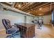 Home gym featuring exposed ceilings, an office space, and various exercise equipment at 5215 Silver Creek Dr, Lilburn, GA 30047