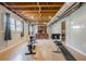 Home gym with exposed ceilings, an office space, an exercise bike, and a weight bench at 5215 Silver Creek Dr, Lilburn, GA 30047