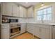Well-equipped kitchen showcases stainless steel appliances, ample cabinet space, and modern finishes at 5215 Silver Creek Dr, Lilburn, GA 30047