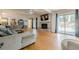Spacious living room featuring a brick fireplace, hardwood floors, and sliding glass doors to the outside at 5215 Silver Creek Dr, Lilburn, GA 30047