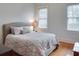 Comfortable bedroom with hardwood floors, a neutral color palette, and natural light at 811 Ponce De Leon Ne Pl, Atlanta, GA 30306