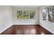 Bright room showcasing hardwood floors, crown molding, and large windows at 811 Ponce De Leon Ne Pl, Atlanta, GA 30306