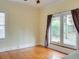 Bedroom with hardwood floors and french doors leading to a private deck at 811 Ponce De Leon Ne Pl, Atlanta, GA 30306