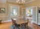 The dining room features hardwood floors, a chandelier, and arched doorways leading to the living room at 811 Ponce De Leon Ne Pl, Atlanta, GA 30306