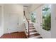 Bright entryway featuring tiled flooring and a staircase with wood treads and white risers at 811 Ponce De Leon Ne Pl, Atlanta, GA 30306