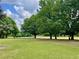 Lush green space with mature trees and walking path with natural landscaping, enhancing its appeal for outdoor activities at 811 Ponce De Leon Ne Pl, Atlanta, GA 30306