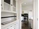 Kitchen with stainless steel appliances, classic tile, and storage blending functionality and classic style at 811 Ponce De Leon Ne Pl, Atlanta, GA 30306