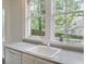 Kitchen featuring a large sink, view from the window, and neutral countertops at 811 Ponce De Leon Ne Pl, Atlanta, GA 30306