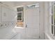 Bright laundry room with a washer-dryer and exterior door, offering convenience and natural light at 811 Ponce De Leon Ne Pl, Atlanta, GA 30306