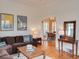 Warm living room featuring hardwood floors and an archway to a dining space, with abundant natural light at 811 Ponce De Leon Ne Pl, Atlanta, GA 30306