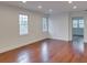Bright living room with hardwood floors, recessed lighting, and large windows at 811 Ponce De Leon Ne Pl, Atlanta, GA 30306