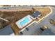 Drone shot of community pool, clubhouse, parking, and surrounding development at 1520 Parks Edge Nw Ln, Atlanta, GA 30318