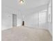 Bright bedroom with carpeted floor, walk-in closet and white doors at 1520 Parks Edge Nw Ln, Atlanta, GA 30318