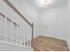 Home entryway featuring wood-style flooring, white walls and trim, leading to the upper level at 1520 Parks Edge Nw Ln, Atlanta, GA 30318