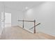 Hallway with neutral carpet, white walls and view to stairway at 1520 Parks Edge Nw Ln, Atlanta, GA 30318