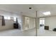 This finished basement has a neutral carpet, a support beam, access to the bathroom, and a glimpse of the bedroom at 1545 Smoke Hill Dr, Hoschton, GA 30548