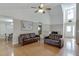 Open-concept living room boasts hardwood floors, vaulted ceilings, and seamless flow to the dining area at 1545 Smoke Hill Dr, Hoschton, GA 30548