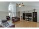 Inviting living room with hardwood floors, soaring ceilings, and plenty of natural light at 1545 Smoke Hill Dr, Hoschton, GA 30548