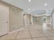 Spacious basement area showcasing tile flooring and neutral paint, ideal for entertaining at 11770 Ashwick Pl, Johns Creek, GA 30005