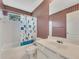 Well-lit bathroom with vintage wallpaper at 11770 Ashwick Pl, Johns Creek, GA 30005