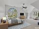 Spacious bedroom features vaulted ceilings, large windows, and neutral decor at 11770 Ashwick Pl, Johns Creek, GA 30005
