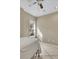 Comfortable bedroom showcasing tile flooring, ceiling fan, and large window at 11770 Ashwick Pl, Johns Creek, GA 30005