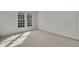 A well-lit bedroom with lots of light from the large window at 11770 Ashwick Pl, Johns Creek, GA 30005