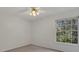 Bedroom with large window providing natural light at 11770 Ashwick Pl, Johns Creek, GA 30005