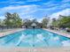 A beautiful community pool offers residents a relaxing place to gather and cool off on hot days at 11770 Ashwick Pl, Johns Creek, GA 30005