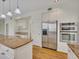 Well-lit kitchen showcases a center island, granite countertops, and stainless steel appliances at 11770 Ashwick Pl, Johns Creek, GA 30005