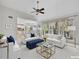 Bright living room with stylish furnishings, including sofas and a coffee table, and an adjacent kitchen at 11770 Ashwick Pl, Johns Creek, GA 30005