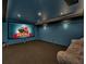 Home theater room features a large screen, projector and comfortable seating at 11770 Ashwick Pl, Johns Creek, GA 30005