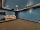 Entertainment area features a large space perfect for movie nights and comfortable seating at 11770 Ashwick Pl, Johns Creek, GA 30005
