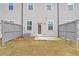 View of the home's backyard with a small patio area and privacy fence at 1512 Parks Edge Nw Ln, Atlanta, GA 30318