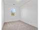 Bright bedroom features neutral carpet, white walls and trim, and a window view at 1512 Parks Edge Nw Ln, Atlanta, GA 30318