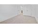 A bedroom with carpet, and an adjacent door, and double door closet at 1512 Parks Edge Nw Ln, Atlanta, GA 30318
