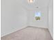A carpeted bedroom with natural light from the window at 1512 Parks Edge Nw Ln, Atlanta, GA 30318