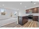 Bright kitchen featuring an island with granite countertop and a window overlooking a view at 1512 Parks Edge Nw Ln, Atlanta, GA 30318