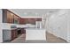 Contemporary kitchen with stainless appliances, dark cabinets, and center island at 1512 Parks Edge Nw Ln, Atlanta, GA 30318