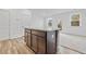 Kitchen island with dark cabinets and granite countertop overlooks carpeted area at 1512 Parks Edge Nw Ln, Atlanta, GA 30318