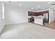 Open-concept living space with kitchen island, and stainless steel appliances at 1512 Parks Edge Nw Ln, Atlanta, GA 30318