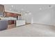 Open-concept living space features kitchen, stainless appliances and a carpeted living area at 1512 Parks Edge Nw Ln, Atlanta, GA 30318