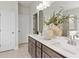 Bright bathroom with double vanity, dual sinks, and modern fixtures at 5260 Trescott Path, Cumming, GA 30028