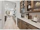 Modern kitchen showcasing ample cabinetry, quartz countertops, and an open layout to the dining area at 5260 Trescott Path, Cumming, GA 30028