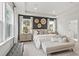 Stylish main bedroom with large windows, tray ceiling, and modern decor at 5260 Trescott Path, Cumming, GA 30028