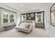 Stylish main bedroom with large windows, tray ceiling, and modern decor at 5260 Trescott Path, Cumming, GA 30028